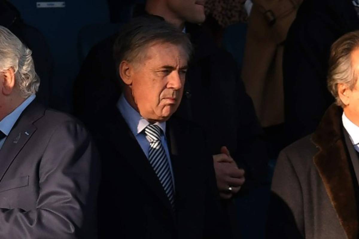 Everton's Italian head coach Carlo Ancelotti looks on from the director's box during the English Premier League football match between Everton and Arsenal at Goodison Park in Liverpool, north west England on December 21, 2019. (Photo by Paul ELLIS / AFP) / RESTRICTED TO EDITORIAL USE. No use with unauthorized audio, video, data, fixture lists, club/league logos or 'live' services. Online in-match use limited to 120 images. An additional 40 images may be used in extra time. No video emulation. Social media in-match use limited to 120 images. An additional 40 images may be used in extra time. No use in betting publications, games or single club/league/player publications. /