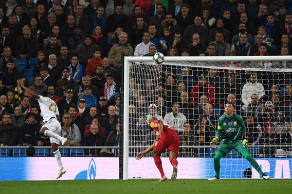 Real Madrid's Brazilian forward Rodrygo (L) scores during the UEFA Champions League Group A football match between Real Madrid and Galatasaray at the Santiago Bernabeu stadium in Madrid, on November 6, 2019. (Photo by GABRIEL BOUYS / AFP)
