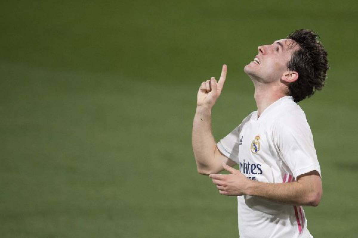 Real Madrid's Spanish defender Alvaro Odriozola celebrates after scoring a goal during the Spanish League football match between Cadiz and Real Madrid at the Ramon de Carranza stadium in Cadiz on April 21, 2021. (Photo by JORGE GUERRERO / AFP)
