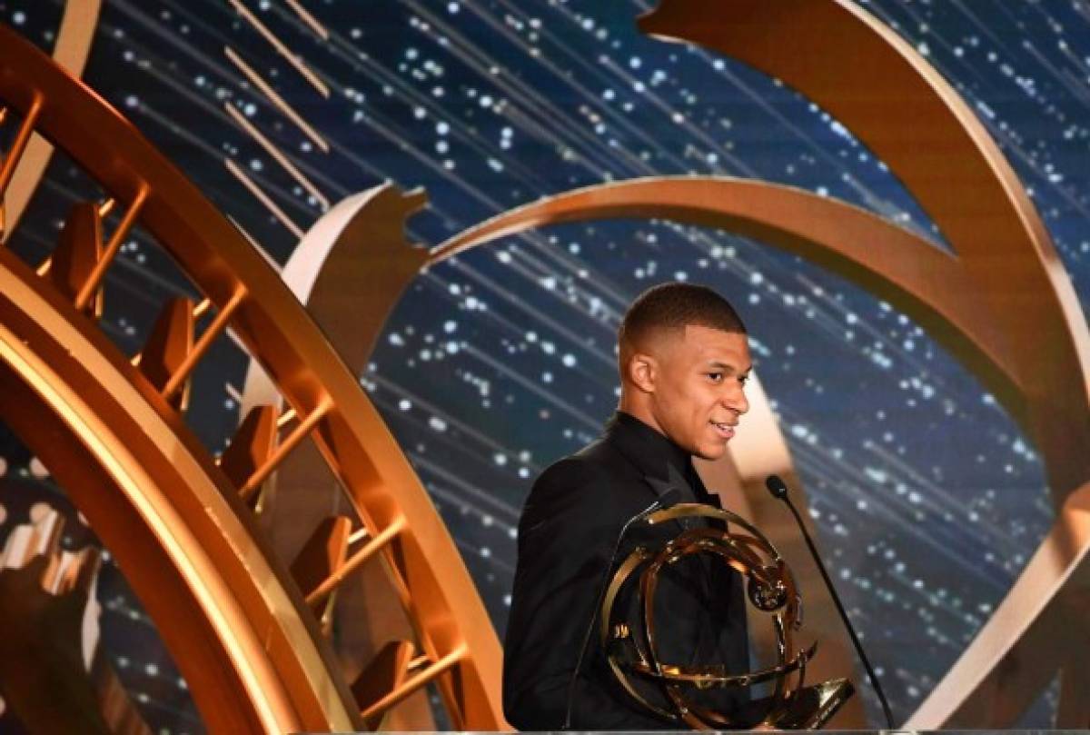 Paris Saint-Germain's French forward Kylian Mbappe delivers a speech after after receiving the Best Ligue 1 player award, on May 19, 2019 in Paris, during the 28th edition of the UNFP (French National Professional Football players Union) trophy ceremony. (Photo by FRANCK FIFE / AFP)