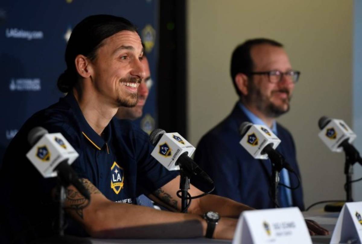 CARSON, CA - MARCH 30: Zlatan Ibrahimovic #9 of the Los Angeles Galaxy answers questions from the media as Team President Chris Klein, and President and CEO of AEG Dan Beckerman, look on during a press conference at StubHub Center on March 30, 2018 in Carson, California. Jayne Kamin-Oncea/Getty Images/AFP== FOR NEWSPAPERS, INTERNET, TELCOS & TELEVISION USE ONLY ==