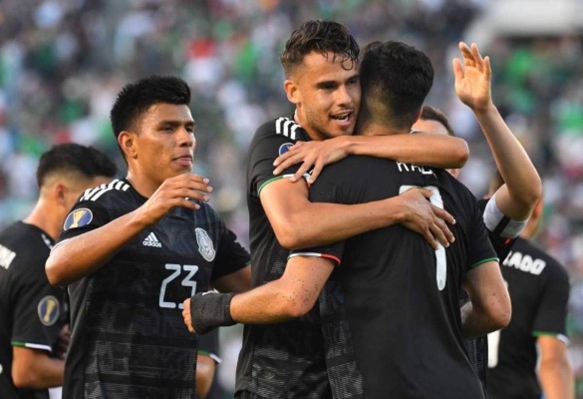 PASADENA, CA - JUNE 15: Diego Reyes #5 celebrates with Raul Jimenez #9 of Mexico after he scored a goal in the first half of the game against Cuba at the Rose Bowl on June 15, 2019 in Pasadena, California. Jayne Kamin-Oncea/Getty Images/AFP== FOR NEWSPAPERS, INTERNET, TELCOS & TELEVISION USE ONLY ==