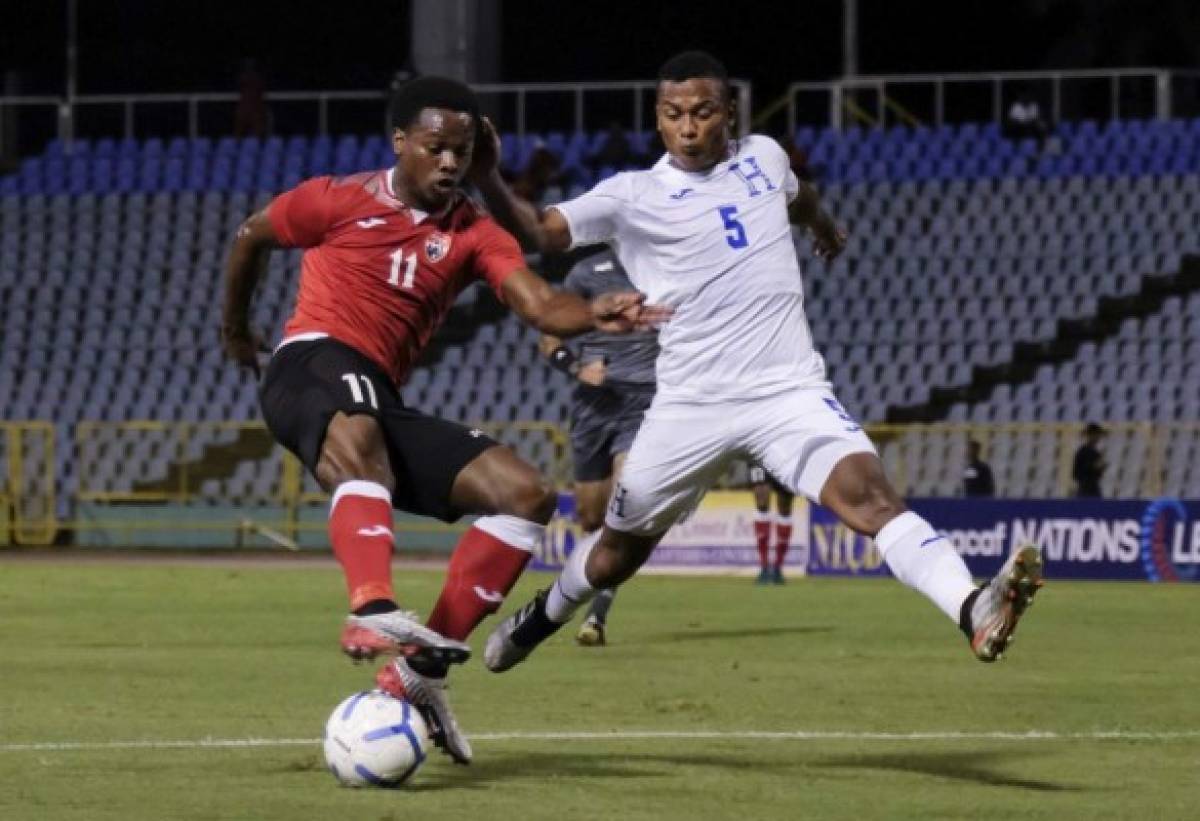 Handout photo released by Concacaf of Levi Garcia of Trinidad and Tobago (L) and Ever Alvarado of Honduras fighting for the ball during a Concacaf Nations League football match at the Hasely Crawford Stadium in Port of Spain, Trinidad and Tobago on October 10, 2019. (Photo by HO / CONCACAF / AFP) / RESTRICTED TO EDITORIAL USE - MANDATORY CREDIT 'AFP PHOTO / CONCACAF ' - NO MARKETING NO ADVERTISING CAMPAIGNS - DISTRIBUTED AS A SERVICE TO CLIENTS