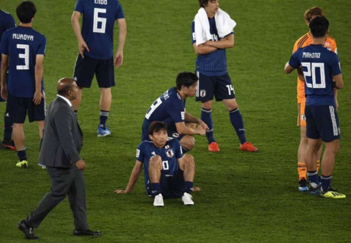 Japan's players react to their defeat during the 2019 AFC Asian Cup final football match between Japan and Qatar at the Mohammed Bin Zayed Stadium in Abu Dhabi on February 1, 2019. (Photo by Khaled DESOUKI / AFP)
