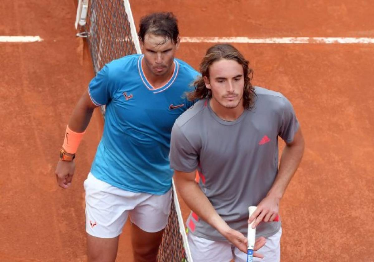 EDITORS NOTE: Graphic content / Rafael Nadal of Spain poses with Greece's Stefanos Tsitsipas after after winning their ATP Masters tournament semi-final tennis match at the Foro Italico camp in Rome, on May 18, 2019. (Photo by Tiziana FABI / AFP)