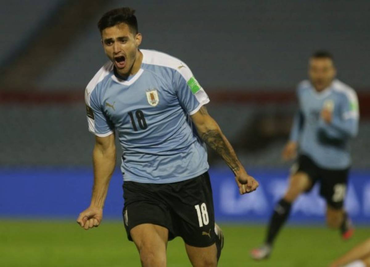 Uruguay's Maximiliano Gomez celebrates after scoring against Chile during their 2022 FIFA World Cup South American qualifier football match at the Centenario Stadium in Montevideo on October 8, 2020, amid the COVID-19 novel coronavirus pandemic. (Photo by Matilde Campodonico / various sources / AFP)