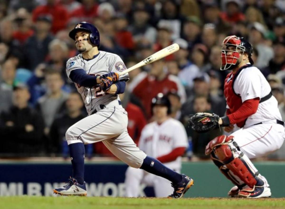 BOSTON, MA - OCTOBER 14: Jose Altuve #27 of the Houston Astros hits an RBI single during the ninth inning against the Boston Red Sox in Game Two of the American League Championship Series at Fenway Park on October 14, 2018 in Boston, Massachusetts. The Red Sox defeated the Astros 7-5. Elsa/Getty Images/AFP