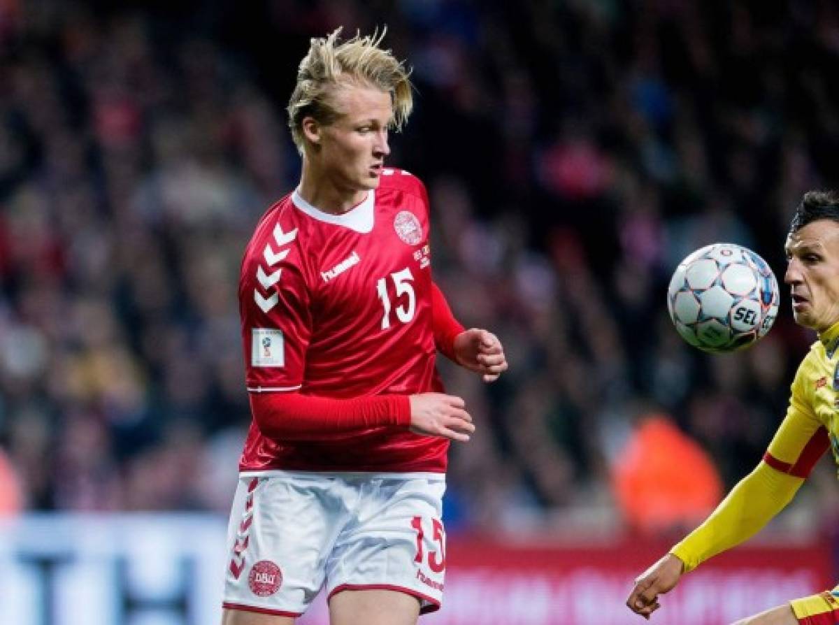Denmark's forward Kasper Dolberg vies with Romania's Vlad Chiriches during the FIFA World Cup 2018 qualification football match between Denmark and Romania in Copenhagen on October 8, 2017. / AFP PHOTO / Scanpix Denmark AND Scanpix / Liselotte Sabroe / Denmark OUT