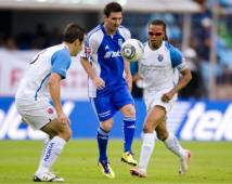 Argentinian footballer Lionel Messi (C) of Messi and Friends vies for the ball with Joaquin Beltran (L) and Edgar Steven Davis of Stars of the World, during their friendly match, in Mexico City, on July 31, 2011. AFP PHOTO/Alfredo ESTRELLA