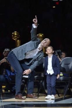SAN ANTONIO, TX - MARCH 28: Retired San Antonio Spur Player Manu Ginobili is honored during his Jersey Retirement Ceremony alongside his son after the game between the San Antonio Spurs and Cleveland Cavaliers on March 28, 2018 at the AT&T Center in San Antonio, Texas. NOTE TO USER: User expressly acknowledges and agrees that, by downloading and or using this photograph, user is consenting to the terms and conditions of the Getty Images License Agreement. Mandatory Copyright Notice: Copyright 2018 NBAE Mark Sobhani/NBAE via Getty Images/AFP