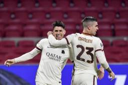 Roma's Brazilian defender Roger (L) celebrates with Roma's Italian defender Gianluca Mancini after scoring a goal during the UEFA Europa League quarter-final football match between Ajax Amsterdam and AS Roma at the Johan Cruijff Arena in Amsterdam on April 8, 2021. (Photo by JOHN THYS / AFP)