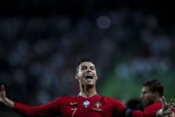 Portugal's forward Cristiano Ronaldo celebrates after scoring a goal during the Euro 2020 qualifier group B football match between Portugal and Luxembourg at the Jose Alvalade stadium in Lisbon on October 11, 2019. (Photo by CARLOS COSTA / AFP)