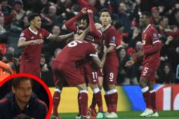 Liverpool's Egyptian midfielder Mohamed Salah celebrates after scoring their second goal with teammates during the UEFA Champions League first leg semi-final football match between Liverpool and Roma at Anfield stadium in Liverpool, north west England on April 24, 2018. / AFP PHOTO / Filippo MONTEFORTE