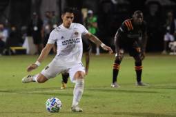 REUNION, FLORIDA - JULY 23: Cristian Pavon #10 of Los Angeles Galaxy makes a penalty kick to score the first goal of his team during a match against Houston Dynamo as part of group F of MLS Is Back Tournament at ESPN Wide World of Sports Complex on July 23, 2020 in Reunion, Florida. Sam Greenwood/Getty Images/AFP