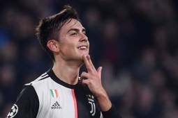 Juventus' Argentine forward Paulo Dybala celebrates after opening the scoring during the UEFA Champions League Group D football match Juventus Turin vs Atletico Madrid on November 26, 2019 at the Juventus Allianz stadium in Turin. (Photo by Marco Bertorello / AFP)