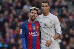 Lionel Messi junto a Cristiano Ronaldo en el último clásico disputado.