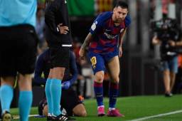 Lionel Messi al momento de sentir sus problemas físicos. Malas noticias en el Barcelona. FOTO: AFP.