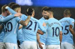Manchester City's Argentinian striker Sergio Aguero (2R) celebrates after scoring their third goal with teammates during the English Premier League football match between Manchester City and Watford at the Etihad Stadium in Manchester, north west England, on January 2, 2018. / AFP PHOTO / Oli SCARFF / RESTRICTED TO EDITORIAL USE. No use with unauthorized audio, video, data, fixture lists, club/league logos or 'live' services. Online in-match use limited to 75 images, no video emulation. No use in betting, games or single club/league/player publications. /