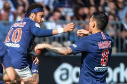 Paris Saint-Germain's Brazilian forward Neymar (L) celebrates with Paris Saint-Germain's Argentine midfielder Leandro Paredes after scoring his team first goal during the French L1 football match between Angers (SCO) and Paris Saint-Germain (PSG), on May 11, 2019, at the Raymond-Kopa Stadium, in Angers. (Photo by JEAN-FRANCOIS MONIER / AFP)