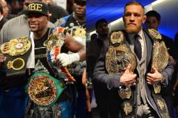 LAS VEGAS, NV - AUGUST 25: Boxer Floyd Mayweather Jr. (L) and UFC lightweight champion Conor McGregor face off during their official weigh-in at T-Mobile Arena on August 25, 2017 in Las Vegas, Nevada. The two will meet in a super welterweight boxing match at T-Mobile Arena on August 26. Ethan Miller/Getty Images/AFP== FOR NEWSPAPERS, INTERNET, TELCOS & TELEVISION USE ONLY ==