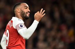 Arsenal's French striker Alexandre Lacazette celebrates scoring his team's second goal during the English Premier League football match between Arsenal and Newcastle United at the Emirates Stadium in London on April 1, 2019. (Photo by Glyn KIRK / AFP) / RESTRICTED TO EDITORIAL USE. No use with unauthorized audio, video, data, fixture lists, club/league logos or 'live' services. Online in-match use limited to 120 images. An additional 40 images may be used in extra time. No video emulation. Social media in-match use limited to 120 images. An additional 40 images may be used in extra time. No use in betting publications, games or single club/league/player publications. /
