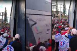 Aficionados captaron el momento en el que seguidores del Olimpia intentaron derribar uno de los portones del estadio Nacional.