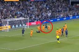 KANSAS CITY, KANSAS - MARCH 07: Roger Espinoza #15 of Sporting Kansas City scores as goalkeeper Marko Maric #1 of Houston Dynamo dives during the 1st half of the game at Children's Mercy Park on March 07, 2020 in Kansas City, Kansas. Jamie Squire/Getty Images/AFP