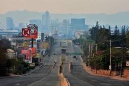 Picture of Suyapa Avenue in Tegucigalpa, seen almost empty due to precautionary measures taken against the spread of the new coronavirus, COVID-19, on April 26, 2020. (Photo by ORLANDO SIERRA / AFP)