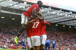 Los jugadores del United celebrando el gol de Fellaini.
