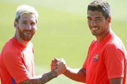 Lionel Messi juanto a Luis Suárez en un entranamiento con el Barcelona.