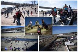 Cientos de centroamericanos de la caravana migrante intentaban este domingo en Tijuana saltar la valla fronteriza que separa a México y Estados Unidos. Fotos AFP