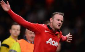 Wayne Rooney y Manchester United festejaron la clasificación en la Champions. (Foto: EFE)