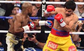 En la 'Pelea del Siglo' se impuso el estilo defensivo de Mayweather y ante un Pacquiao que peleó lesionado. Foto AFP