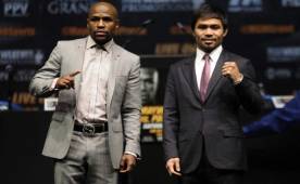 Bob Arum, promotor de Pacquiao dice que no hay contrato con el hotel MGM para la pelea con Mayweather, pero el representante del norteamericano dice que no peligra el combate. Foto AFP