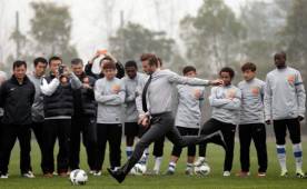 WUHAN, CHINA - MARCH 23: British football player David Beckham kicks the ball during a visit to Wuhan Zall Football Club at Wuhan Hubei Province on March 23, 2013 in Wuhan, China. Beckham is on a five-day visit to China at the invitation of the China Football Association as China's first international ambassador. (Photo by Lintao Zhang/Getty Images)