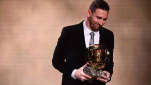 Barcelona's Argentinian forward Lionel Messi reacts after winning the Ballon d'Or France Football 2019 trophy at the Chatelet Theatre in Paris on December 2, 2019. - Lionel Messi won a record-breaking sixth Ballon d'Or on Monday after another sublime year for the Argentinian, whose familiar brilliance remained undimmed even through difficult times for club and country. (Photo by FRANCK FIFE / AFP)