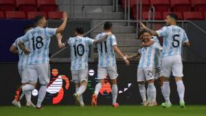 Argentina's Alejandro Gomez (3rd R) celebrates with teammates after scoring against Paraguay during their Conmebol Copa America 2021 football tournament group phase match at the Mane Garrincha Stadium in Brasilia on June 21, 2021. (Photo by NELSON ALMEIDA / AFP)
