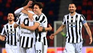 Juventus' Spanish forward Alvaro Morata (Front L fom behind) celebrates with Juventus' Italian forward Federico Chiesa and teammates the 4th goal during the Italian Serie A football match Bologna vs Juventus Turin on May 23, 2021 at the Renato-Dall'Ara stadium in Bologna. (Photo by ANDREAS SOLARO / AFP)