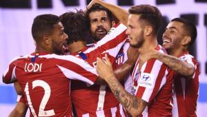 Atletico Madrid's Diego Costa (C) celebrates with teammates after scoring a second goal during the 2019 International Champions Cup football match between Real Madrid and Atletico Madrid at the Metlife Stadium Arena in East Rutherford, New Jersey on July 26, 2019. (Photo by Johannes EISELE / AFP)