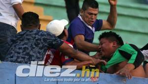 Aficionados del Olimpia golpearon y despojaron de su camiseta a uno del Marathón.