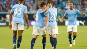 MIAMI, FL - JULY 28: Brahim Diaz #55 of Manchester City celebrates with Bernardo Silva #20 after his goal against Bayern Munich in the first half of the International Champions Cup at Hard Rock Stadium on July 28, 2018 in Miami, Florida. Michael Reaves/Getty Images/AFP