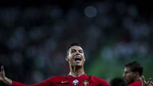 Portugal's forward Cristiano Ronaldo celebrates after scoring a goal during the Euro 2020 qualifier group B football match between Portugal and Luxembourg at the Jose Alvalade stadium in Lisbon on October 11, 2019. (Photo by CARLOS COSTA / AFP)