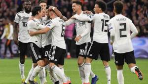 Germany's players celebrate after scoring their second goal during the UEFA Euro 2020 Group C qualification football match between The Netherlands and Germany at the Johan Cruyff Arena in Amsterdam on March 24, 2019. (Photo by EMMANUEL DUNAND / AFP)