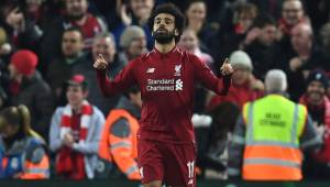 Liverpool's Egyptian midfielder Mohamed Salah celebrates scoring the opening goal during the UEFA Champions League group C football match between Liverpool and Napoli at Anfield stadium in Liverpool, north west England on December 11, 2018. (Photo by Paul ELLIS / AFP)