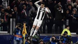 Juventus' Portuguese forward Cristiano Ronaldo celebrates after scoring 3-0 during the UEFA Champions League round of 16 second-leg football match Juventus vs Atletico Madrid on March 12, 2019 at the Juventus stadium in Turin. (Photo by Filippo MONTEFORTE / AFP)