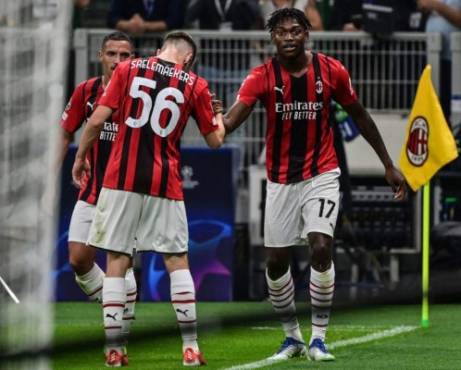 AC Milan's Portuguese forward Rafael Leao (R) celebrates after opening the scoringduring the UEFA Champions League Group B football match between AC Milan and Atletico Madrid on September 28, 2021 at the San Siro stadium in Milan. (Photo by MIGUEL MEDINA / AFP)