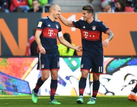 Bayern Munich's Dutch midfielder Arjen Robben (L) and Bayern Munich's Colombian James Rodriguez (R) react after the third goal during the German first division Bundesliga football match FC Augsburg vs FC Bayern Munich in Augsburg, southern Germany, on April 7, 2018. / AFP PHOTO / Christof STACHE / RESTRICTIONS: DURING MATCH TIME: DFL RULES TO LIMIT THE ONLINE USAGE TO 15 PICTURES PER MATCH AND FORBID IMAGE SEQUENCES TO SIMULATE VIDEO. == RESTRICTED TO EDITORIAL USE == FOR FURTHER QUERIES PLEASE CONTACT DFL DIRECTLY AT + 49 69 650050