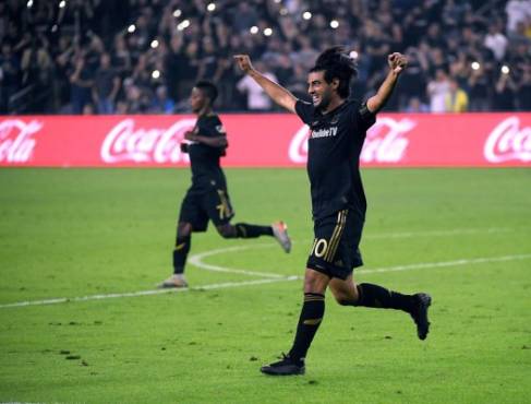 LOS ANGELES, CALIFORNIA - OCTOBER 24: Carlos Vela #10 of Los Angeles FC celebrates the whistle at the end of the game with Latif Blessing #7 during a 5-3 win over the Los Angeles Galaxy in the Western Conference Semifinals at Banc of California Stadium on October 24, 2019 in Los Angeles, California. Harry How/Getty Images/AFP== FOR NEWSPAPERS, INTERNET, TELCOS & TELEVISION USE ONLY ==