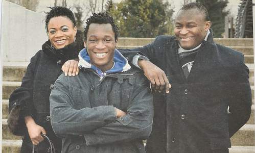 $!Footballer Romelu Lukaku as a teenager with his Mum Adolphine and Dad Roger. Collect picture from the headmaster's scrapbook