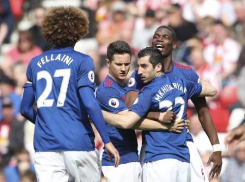 Manchester United's Armenian midfielder Henrikh Mkhitaryan (2R) celebrates scoring their second goal with Manchester United's French midfielder Paul Pogba (R) and Manchester United's Spanish midfielder Ander Herrera (2L) during the English Premier League football match between Sunderland and Manchester United at the Stadium of Light in Sunderland, north-east England on April 9, 2017. / AFP PHOTO / Scott Heppell / RESTRICTED TO EDITORIAL USE. No use with unauthorized audio, video, data, fixture lists, club/league logos or 'live' services. Online in-match use limited to 75 images, no video emulation. No use in betting, games or single club/league/player publications. /